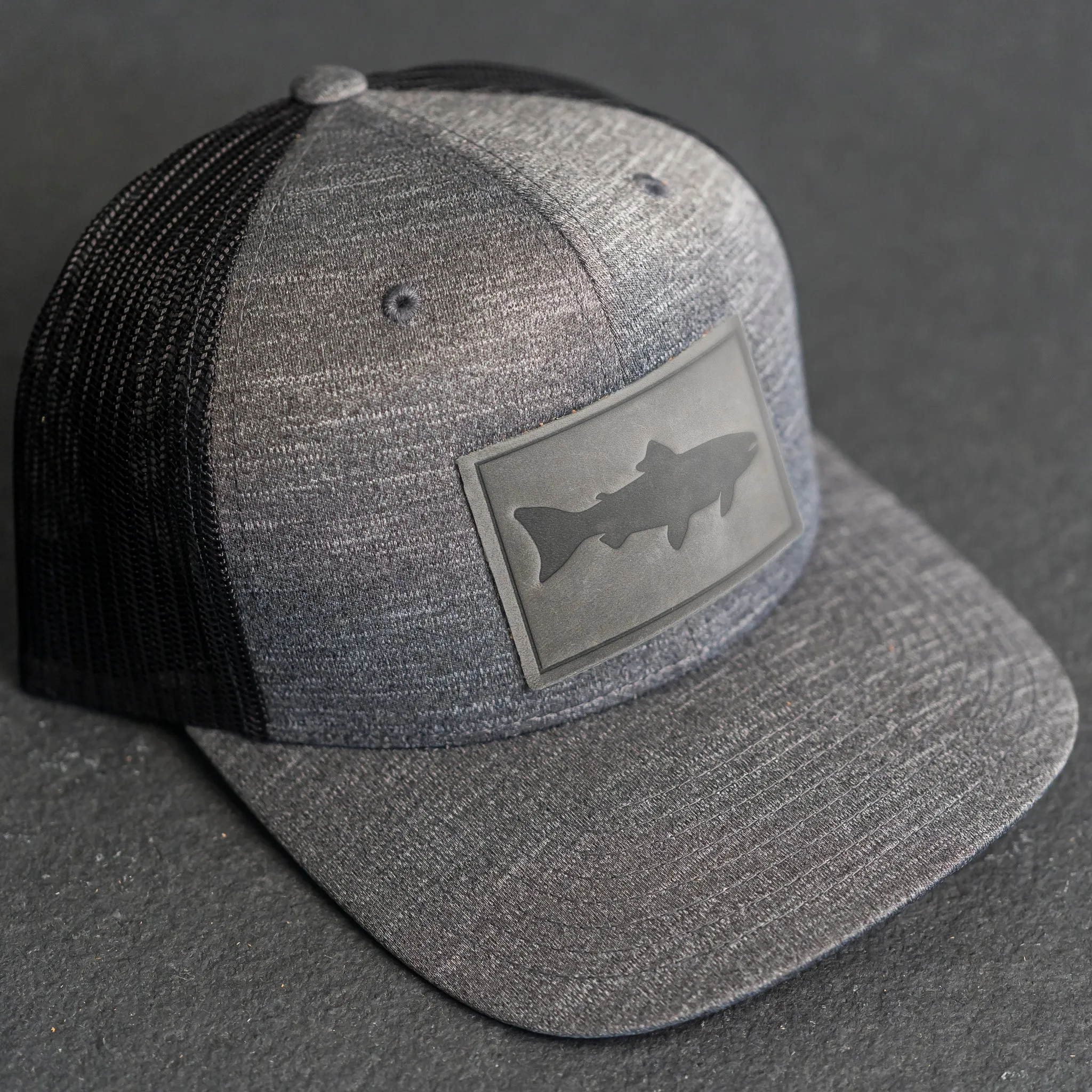 Leather Patch Performance Style Trucker Hat - Fish Stamp