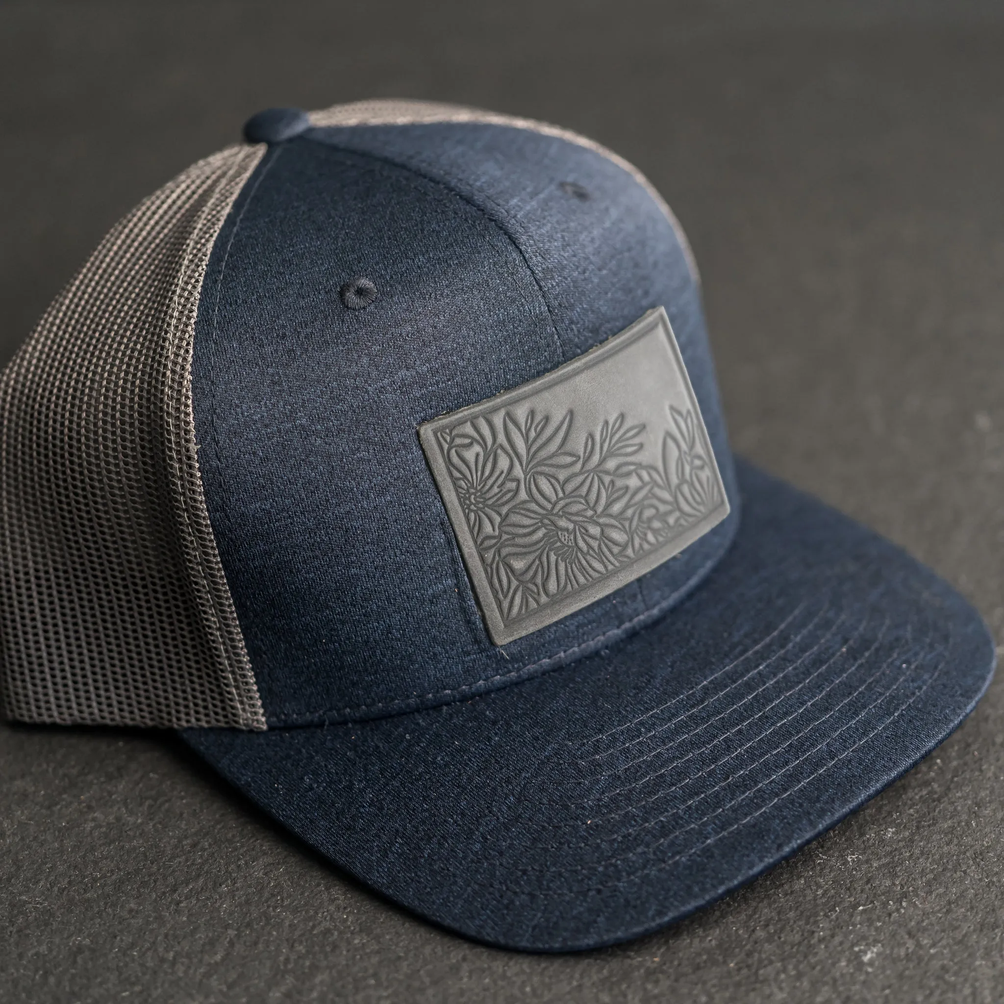 Leather Patch Performance Style Trucker Hat - Floral Stamp