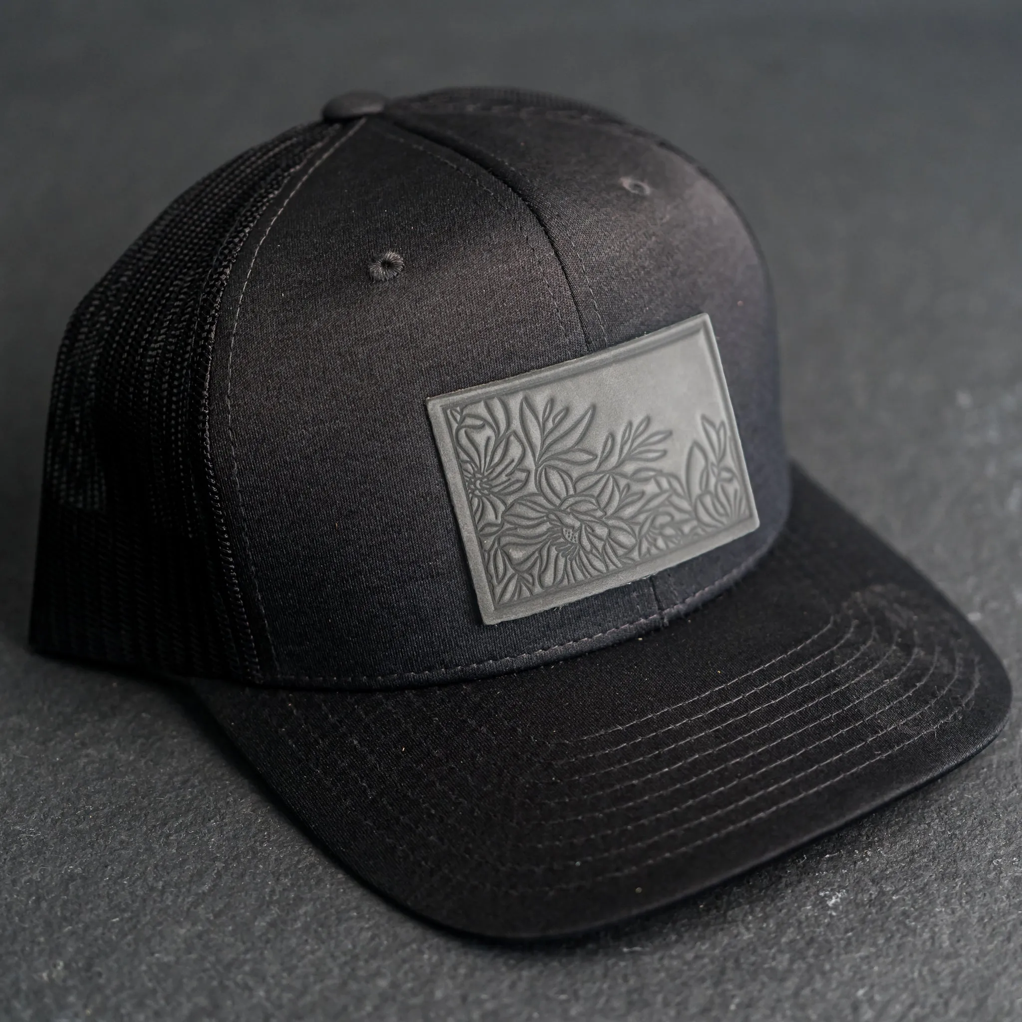 Leather Patch Performance Style Trucker Hat - Floral Stamp