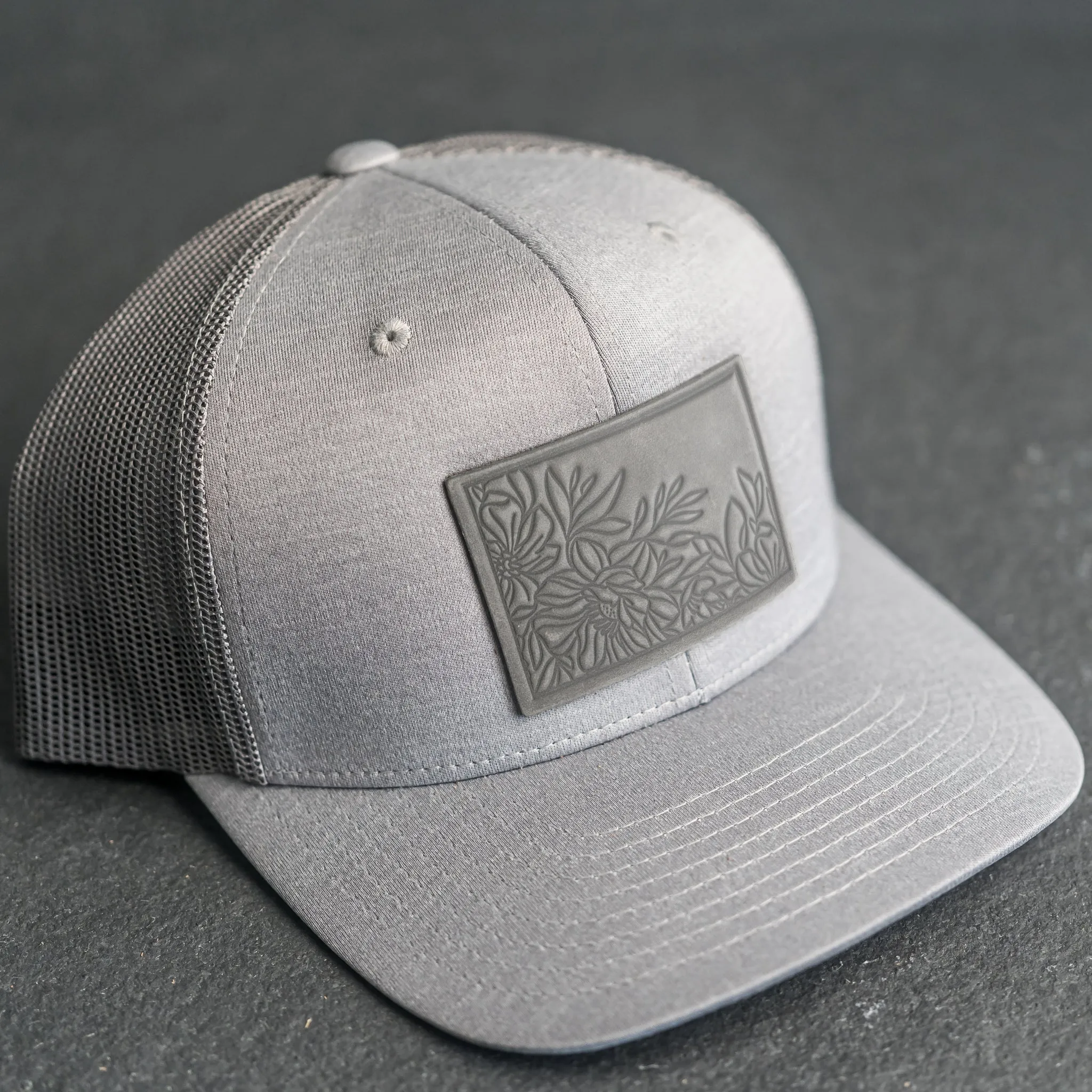 Leather Patch Performance Style Trucker Hat - Floral Stamp