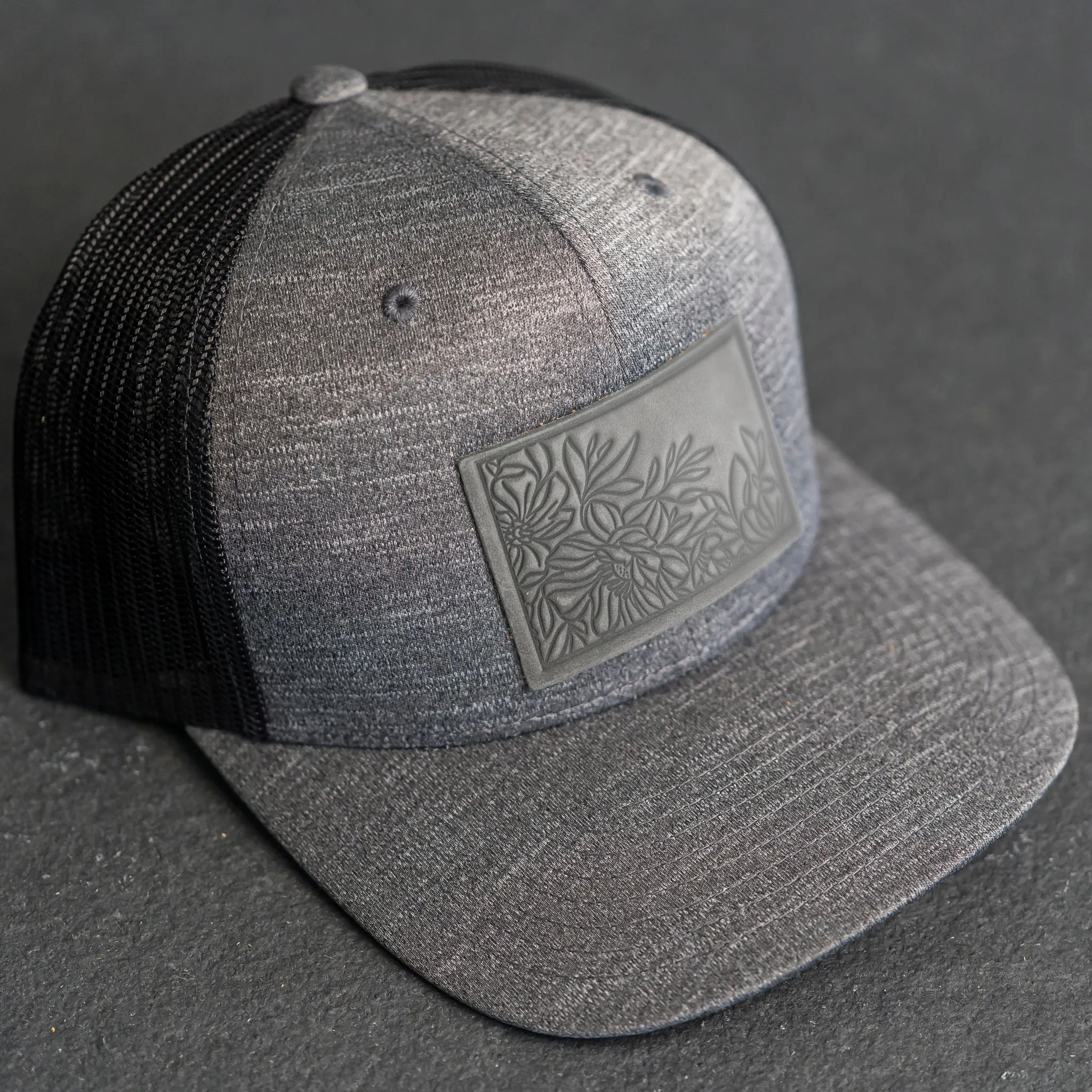 Leather Patch Performance Style Trucker Hat - Floral Stamp