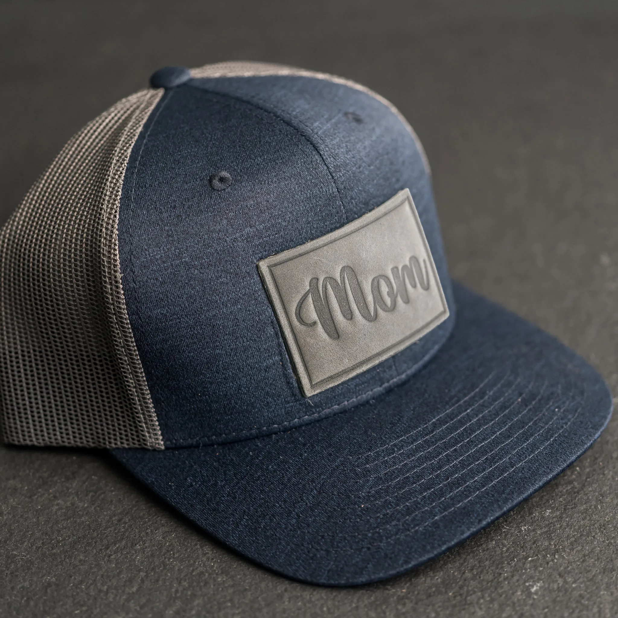 Leather Patch Performance Style Trucker Hat - Mom Cursive Stamp