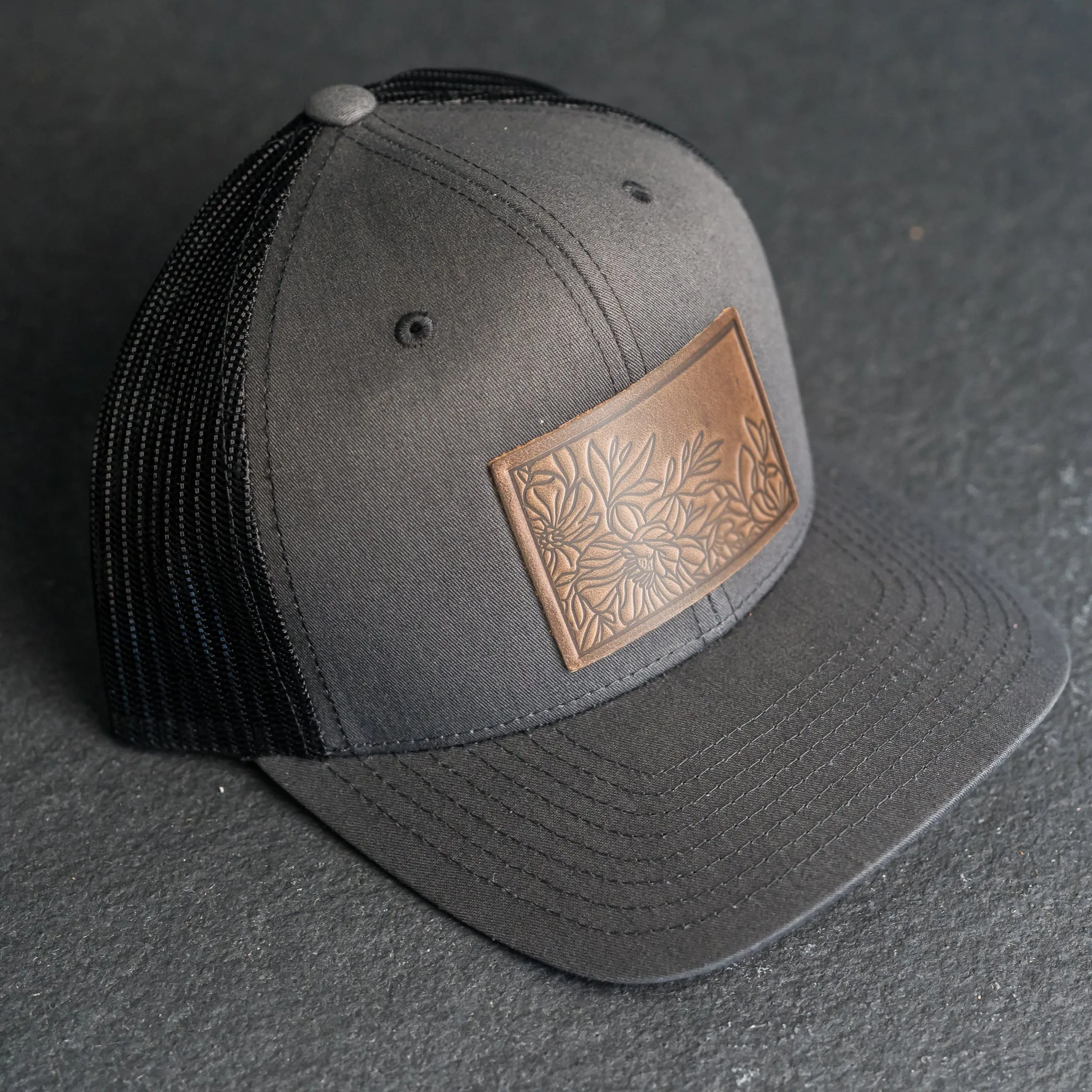 Leather Patch Trucker Style Hat - Floral Stamp