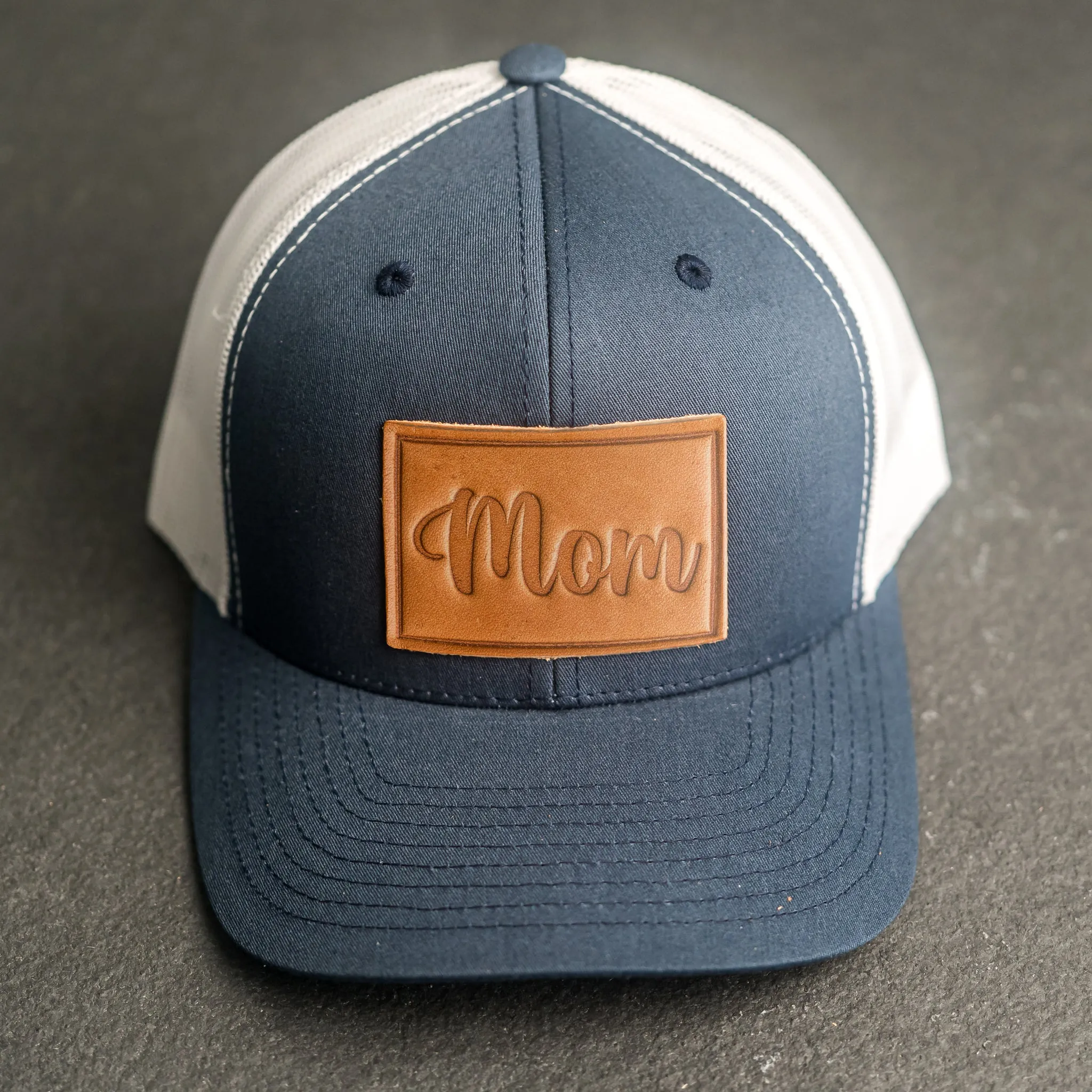 Leather Patch Trucker Style Hat - Mom Cursive Stamp