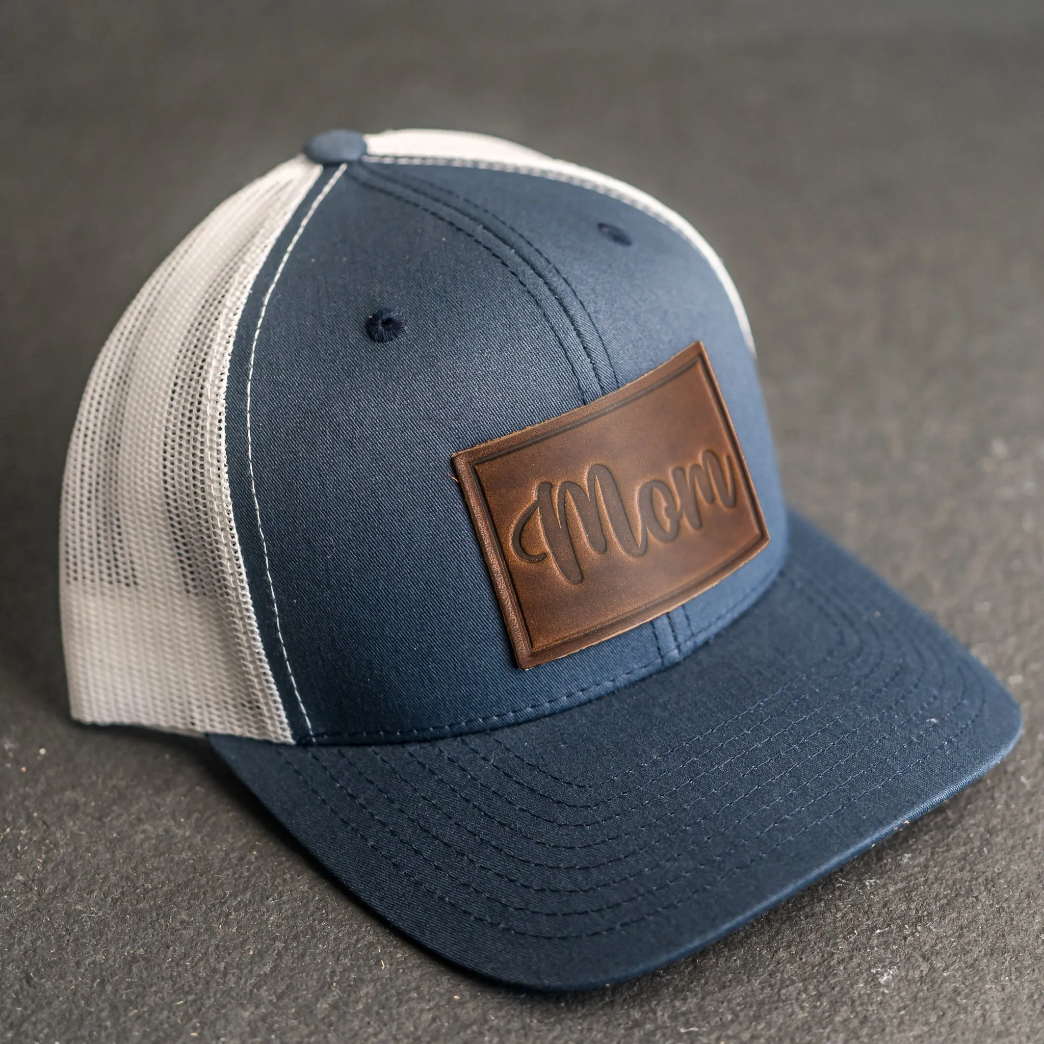 Leather Patch Trucker Style Hat - Mom Cursive Stamp