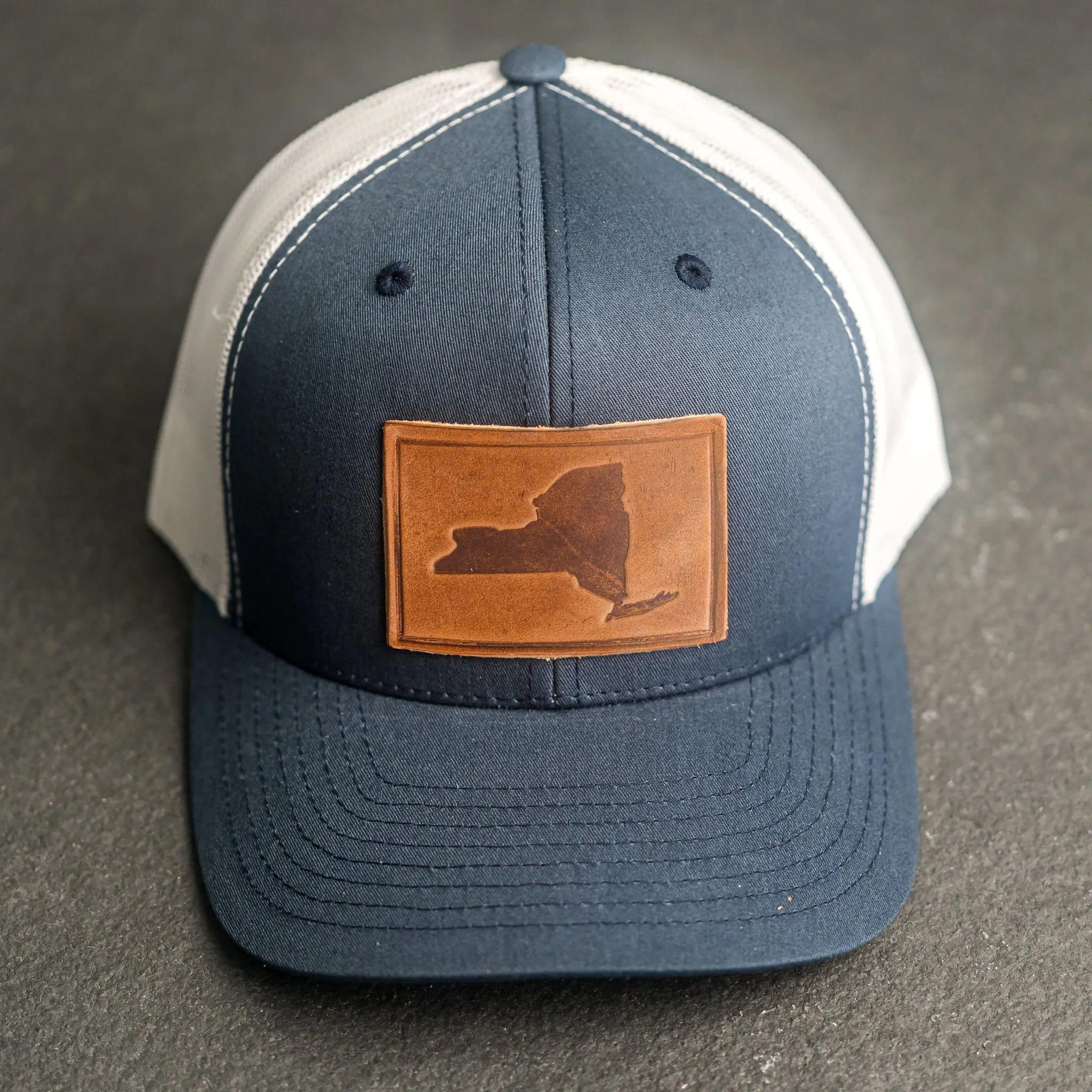 Leather Patch Trucker Style Hat - New York Stamp