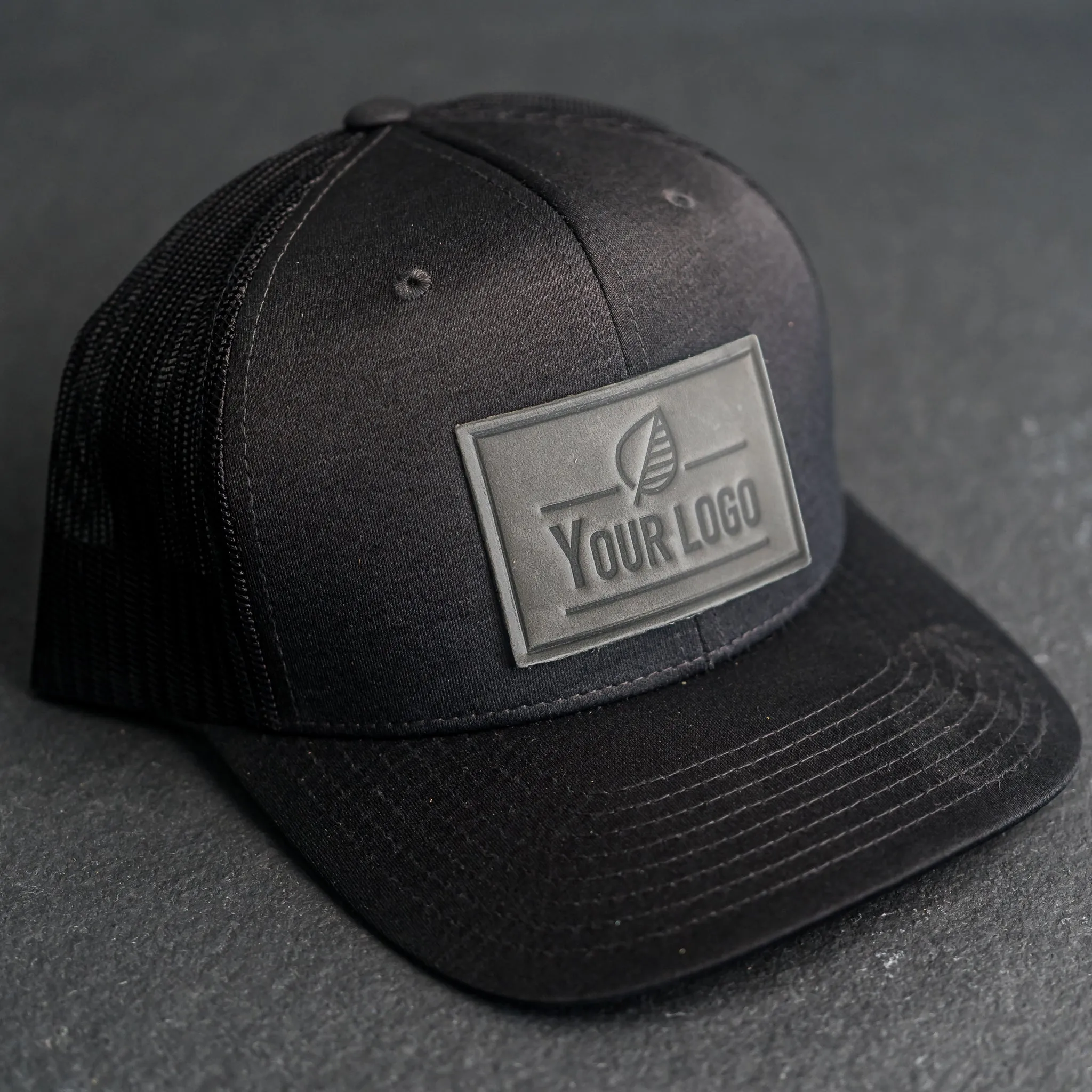 Your Logo on a Leather Patch Performance Style Trucker Hat